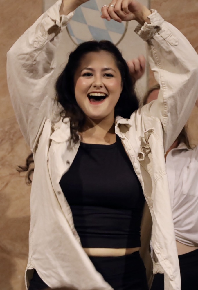 MTB singer performing with arms raised