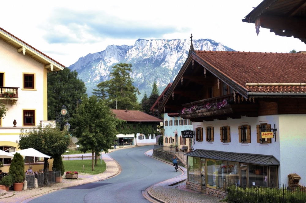 Village street in Oberaudorf with the mountains behind